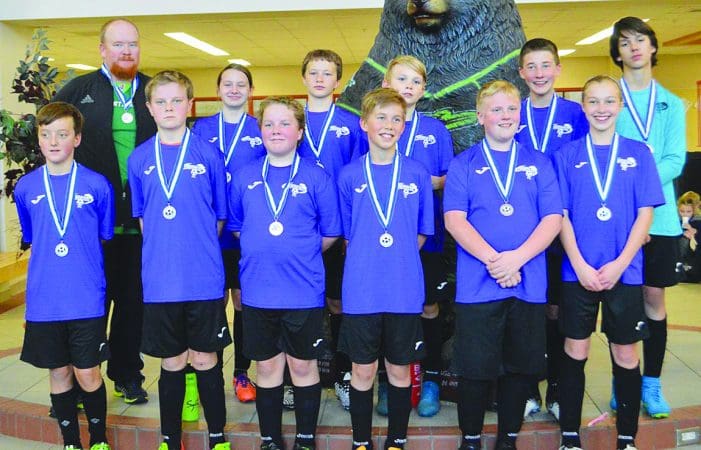 Storm teams kick off indoor soccer season with medals