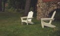 Outdoor chairs on lawn in backyard Money tight? Take a staycation