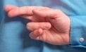 Fingers crossed behind back 6 reasons we suck at spotting liars