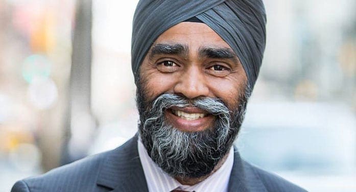 How can Trudeau allow Sajjan to remain in cabinet?