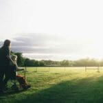 wheelchair caregiver sunset nature sunrise service