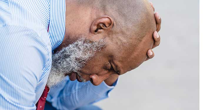 tired older man male sad bald ‘Male menopause’ is real and treatable, say pharmacy researchers